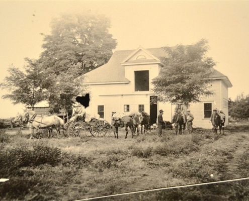 Barn and carriage house behind the Stone residence. Robert Moore and Ben Stone on wagon, Fred Blatter (Stone employee) and Charles Campbell standing, Billy Russell on horse, ca. 1904. B. F. Stone photo collection, Whitman Archives.