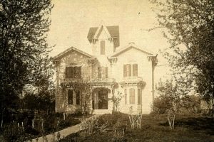 A ca. 1900 photo of the Ward home. The two women on the porch may be Amelia Ward and her daughter Augusta. Whitman Archives.