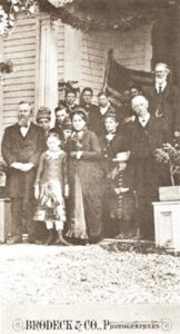 President Rutherford B. Hayes, front left, at the front porch of the Ward home. Mrs. Hayes is front center, and Michael Ward appears on the upper right.