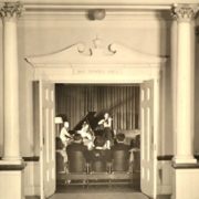 An atmospheric shot from the atrium into MacDowell Hall during a string trio performance – Haydn, Mozart, Beethoven? Whitman Archives.