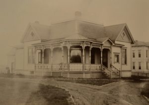 John and Sarah Boyer’s house after it was moved to the corner of Cypress and Otis Streets in 1903, where it currently serves as Das Deutsche Haus for Whitman College. Whitman Archives Photos
