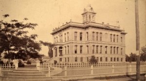 The 1881 Walla Walla County Court House shortly after completion. What was the purpose of the steps that first led visitors through corner gateposts after which they were had to descend to the level of the sidewalk leading to the courthouse entrance? Whitman Archives photo.