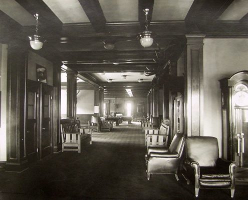 Third floor Card and Billiards Room. The grandfather clock, right, is now located in the entrance hall to the current lodge building. Whitman Archives.